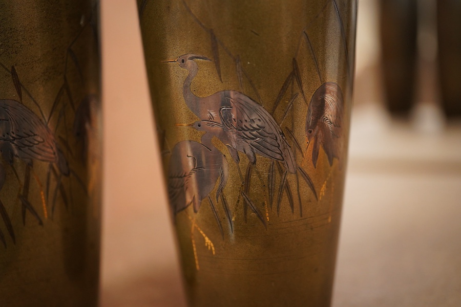 A pair of Japanese Meiji period bronze vases with crane decoration, 15cm high